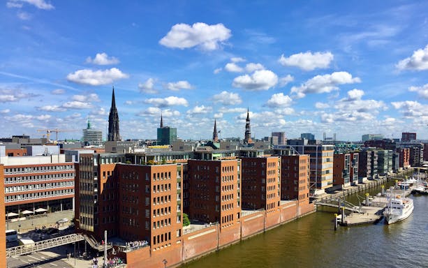 Tourists exploring the UNESCO site Speicherstadt with HafenCity and Elbphilharmonie in Hamburg