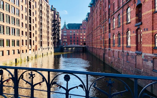 Speicherstadt canal view with historic brick warehouses in Hamburg, Germany.