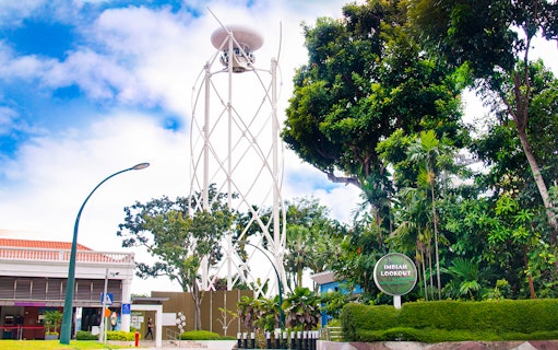 Imbiah Lookout tower surrounded by lush greenery on Sentosa Island, Singapore.