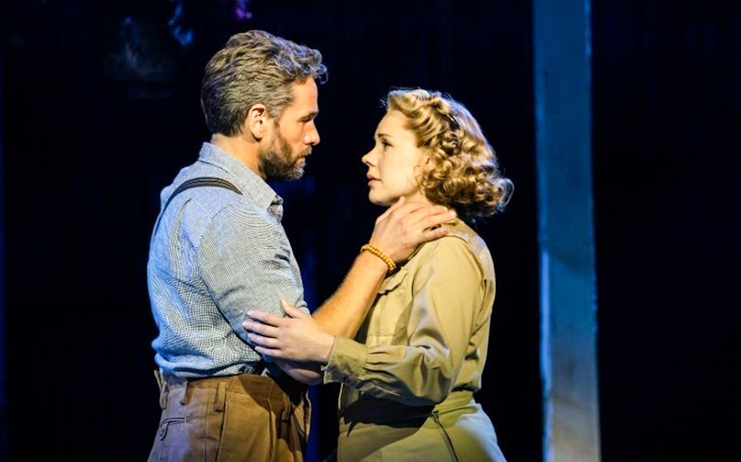 Actors performing a scene from Rodgers & Hammerstein’s South Pacific on stage.