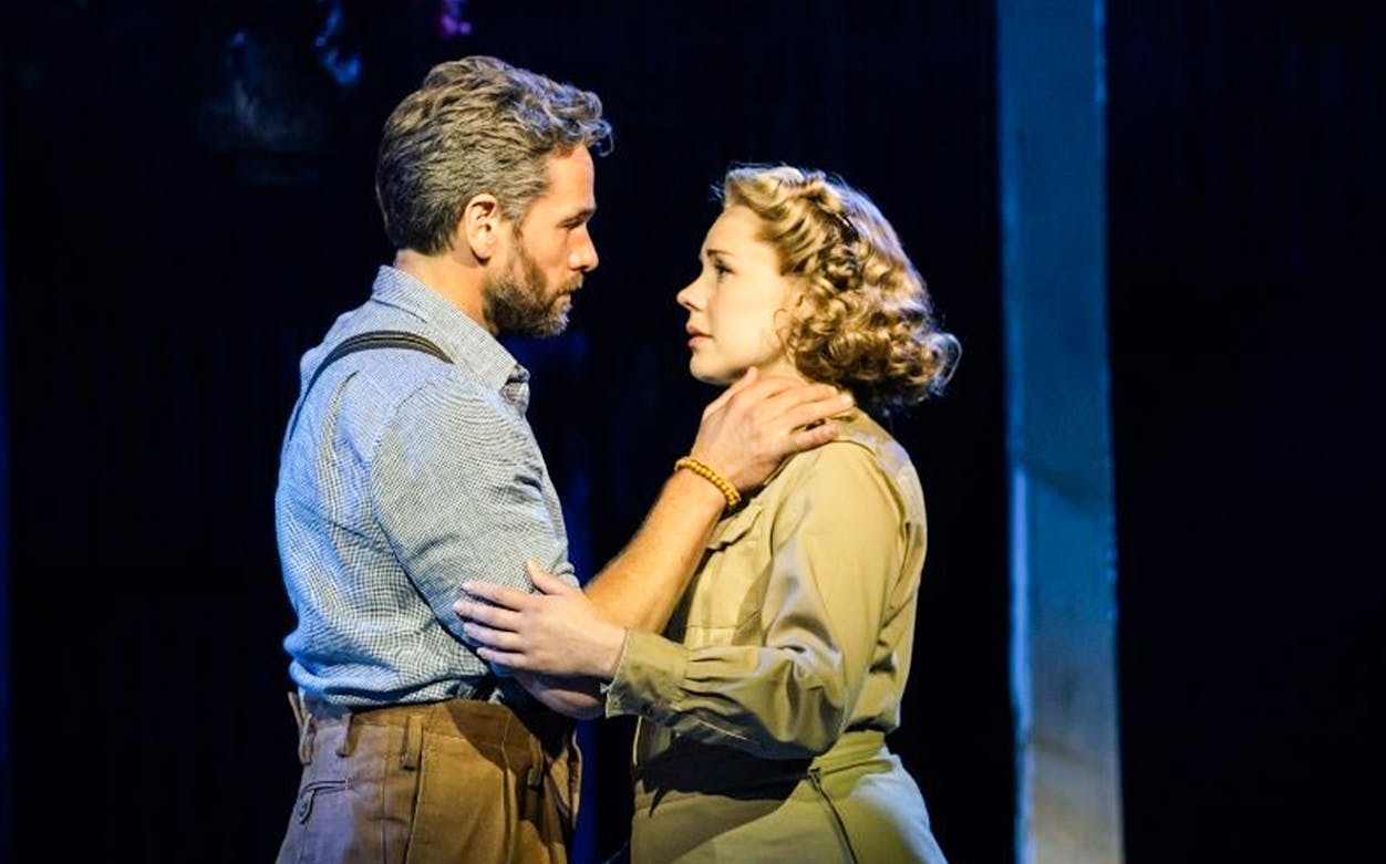 Actors performing a scene from Rodgers & Hammerstein’s South Pacific on stage.