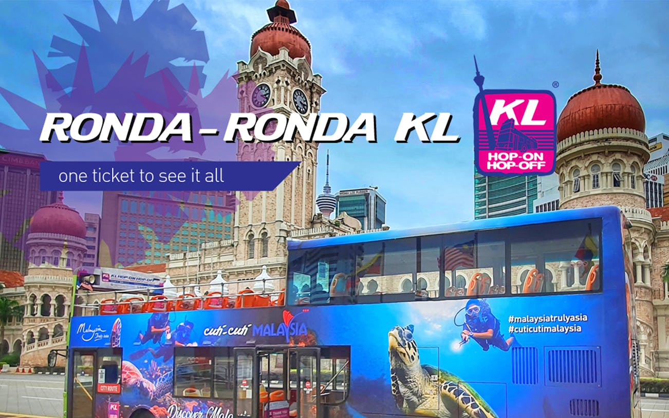 Double-decker bus in front of Sultan Abdul Samad Building, Kuala Lumpur, for KL Ronda Ronda City Tour.