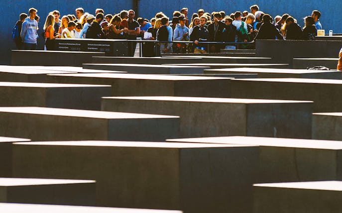 Group of visitors at the Holocaust Memorial in Berlin during a self-guided audio tour.