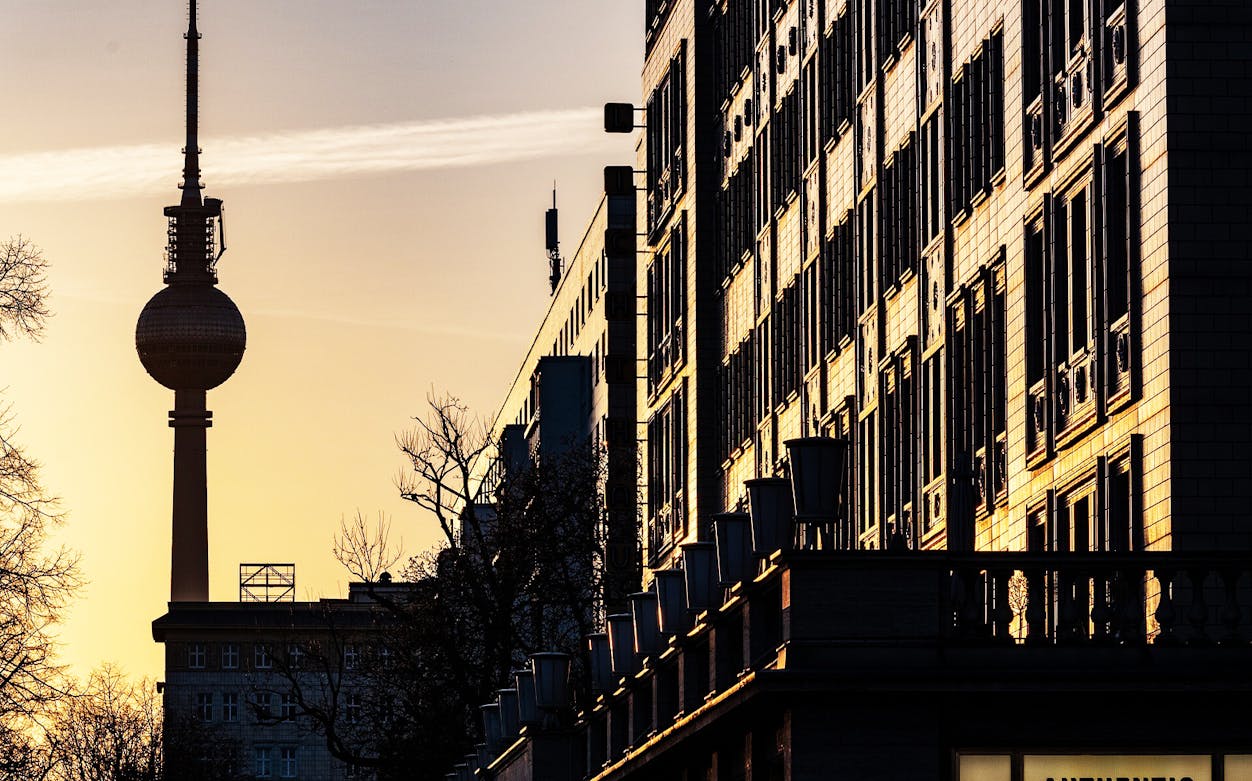 TV Tower and city buildings at sunset in Berlin, Germany.