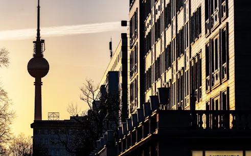 TV Tower and city buildings at sunset in Berlin, Germany.