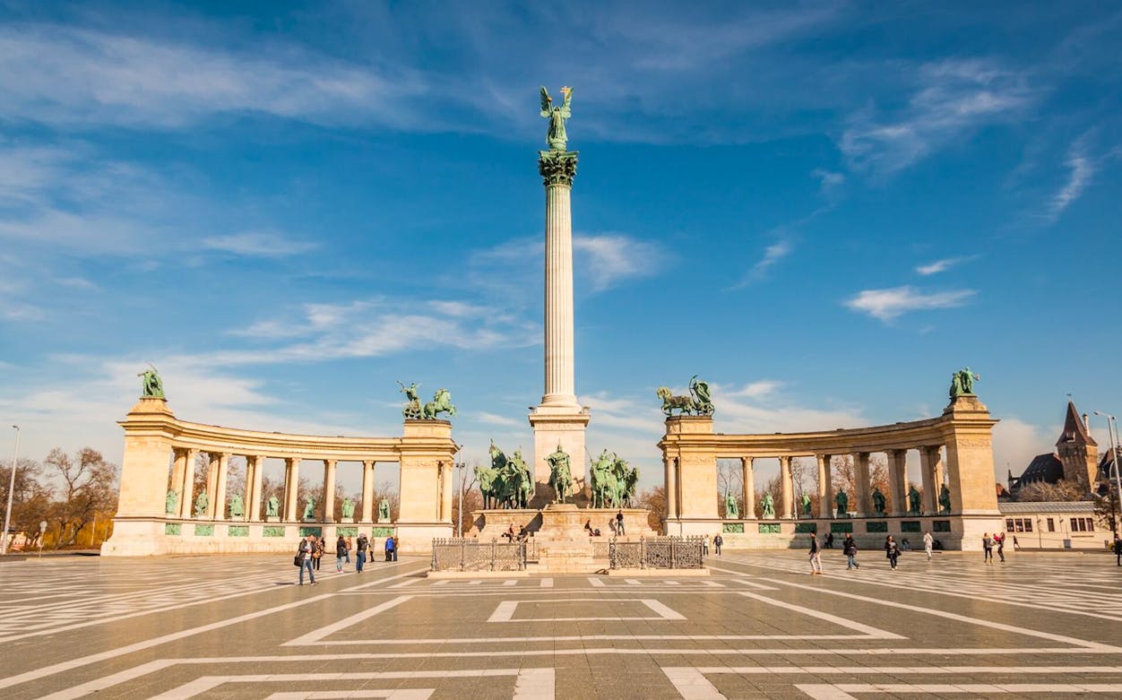 Heroes' Square in Budapest with statues and column on a self-guided tour.