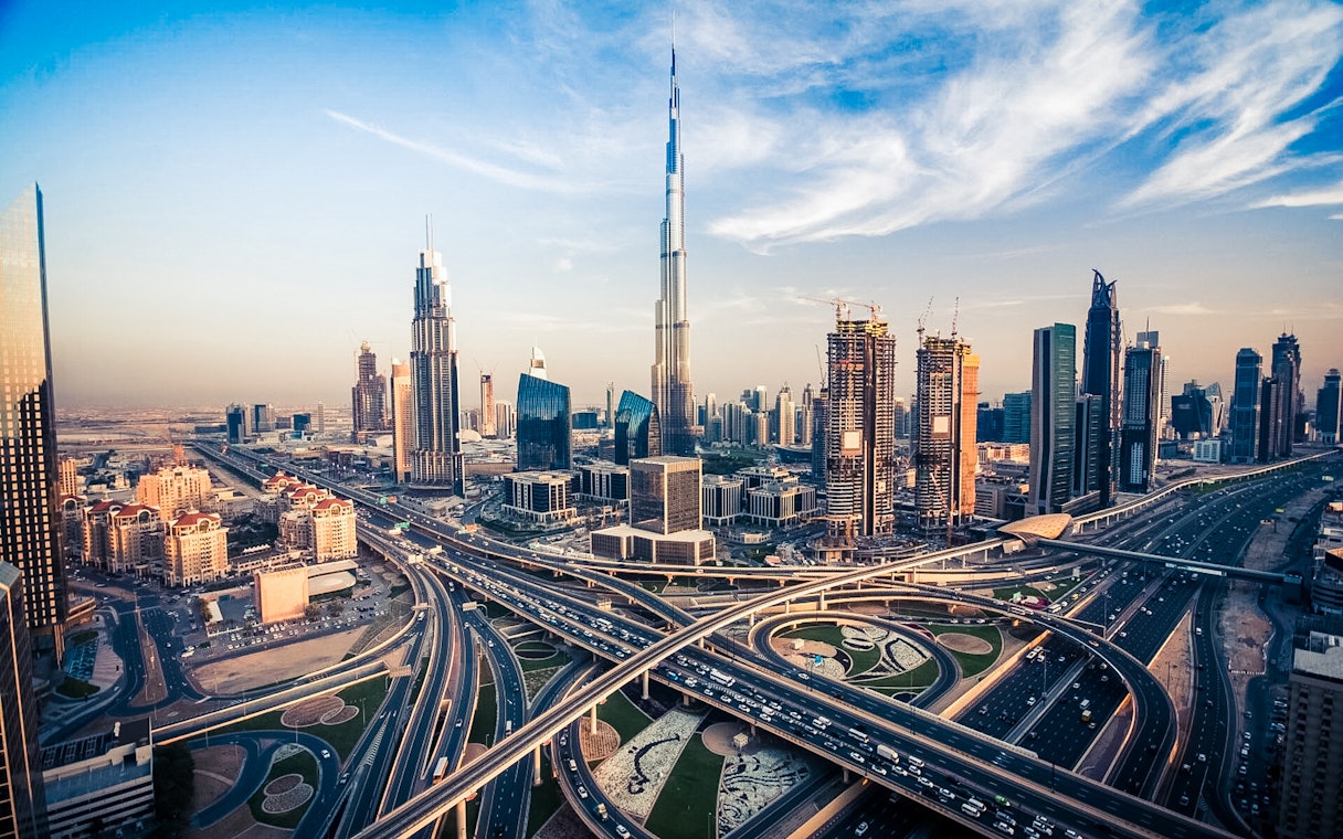 Dubai skyline with Burj Khalifa and modern architecture, viewed from above.