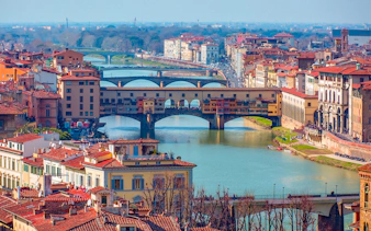 Ponte Vecchio over the Arno River in Florence, Italy, viewed from above.