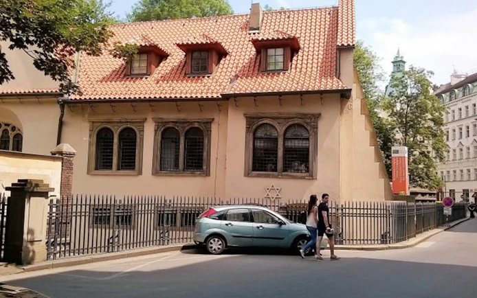 Prague Jewish Quarter, historic building with Star of David, part of 2.5-hour tour.