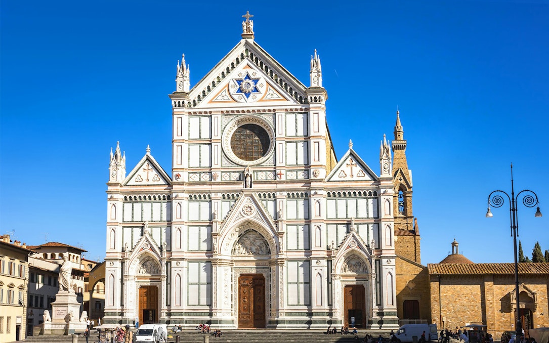 Santa Croce Basilica facade in Florence, Italy, viewed during a self-guided audio tour.