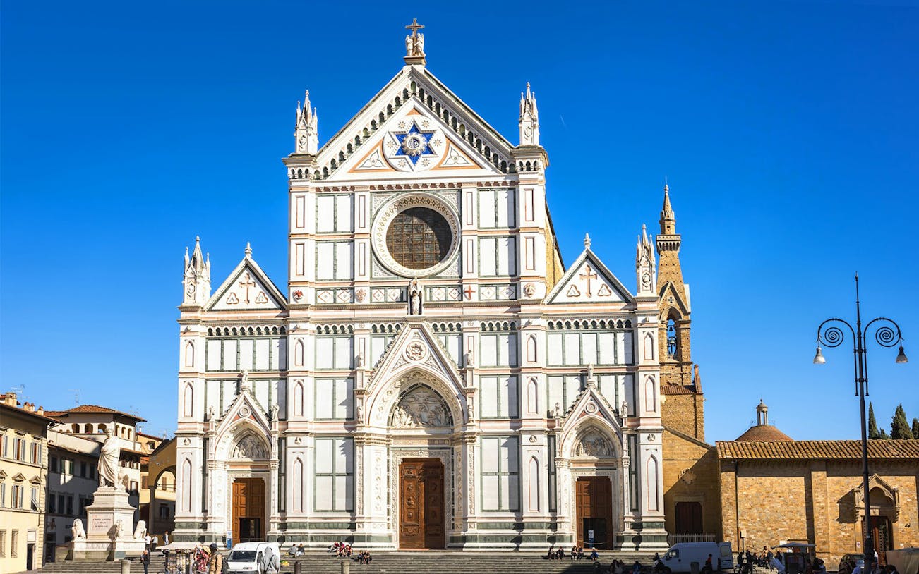 Santa Croce Basilica facade in Florence, Italy, viewed during a self-guided audio tour.