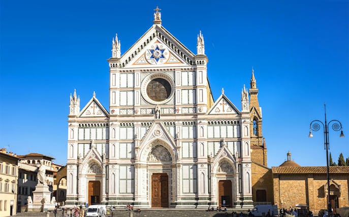 Santa Croce Basilica facade in Florence, Italy, viewed during a self-guided audio tour.
