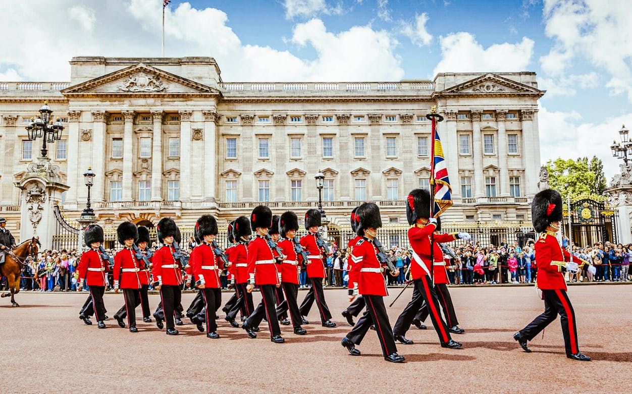Buckingham Palace guards marching during Changing of the Guard ceremony, London.