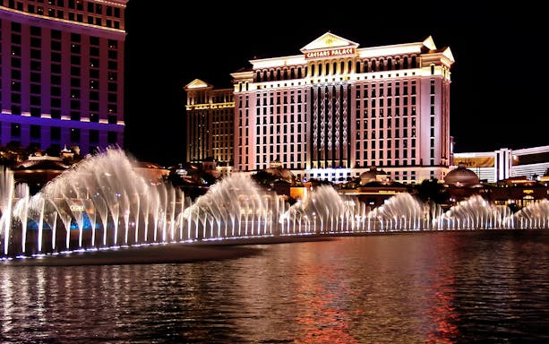 Fountains at night in front of Caesars Palace, Las Vegas Self Guided Audio Tour.