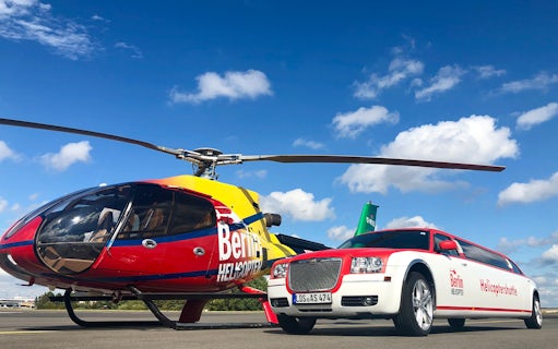 Helicopter and limousine for Rundflug Berlin City tour on a sunny day.