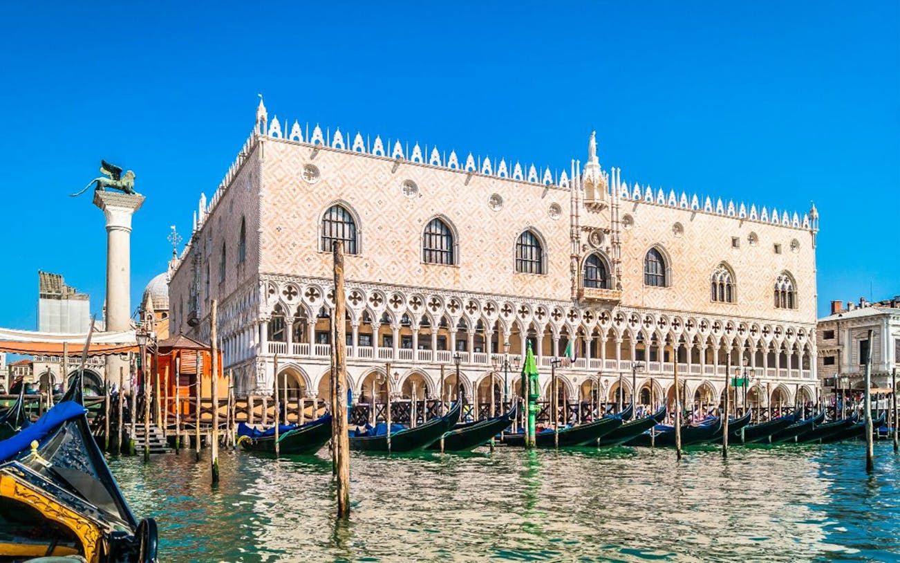 Doge's Palace in Venice with gondolas on the Grand Canal.