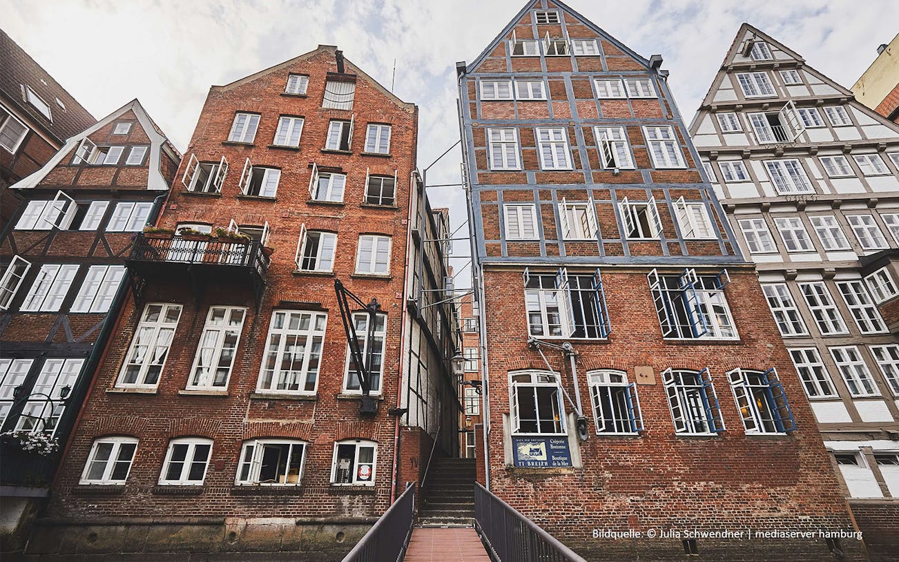 Historic brick buildings in Hamburg's old town on a guided tour.