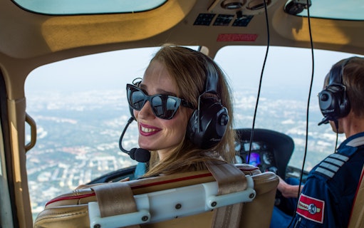 Passenger enjoying a scenic flight over Berlin Brandenburg.