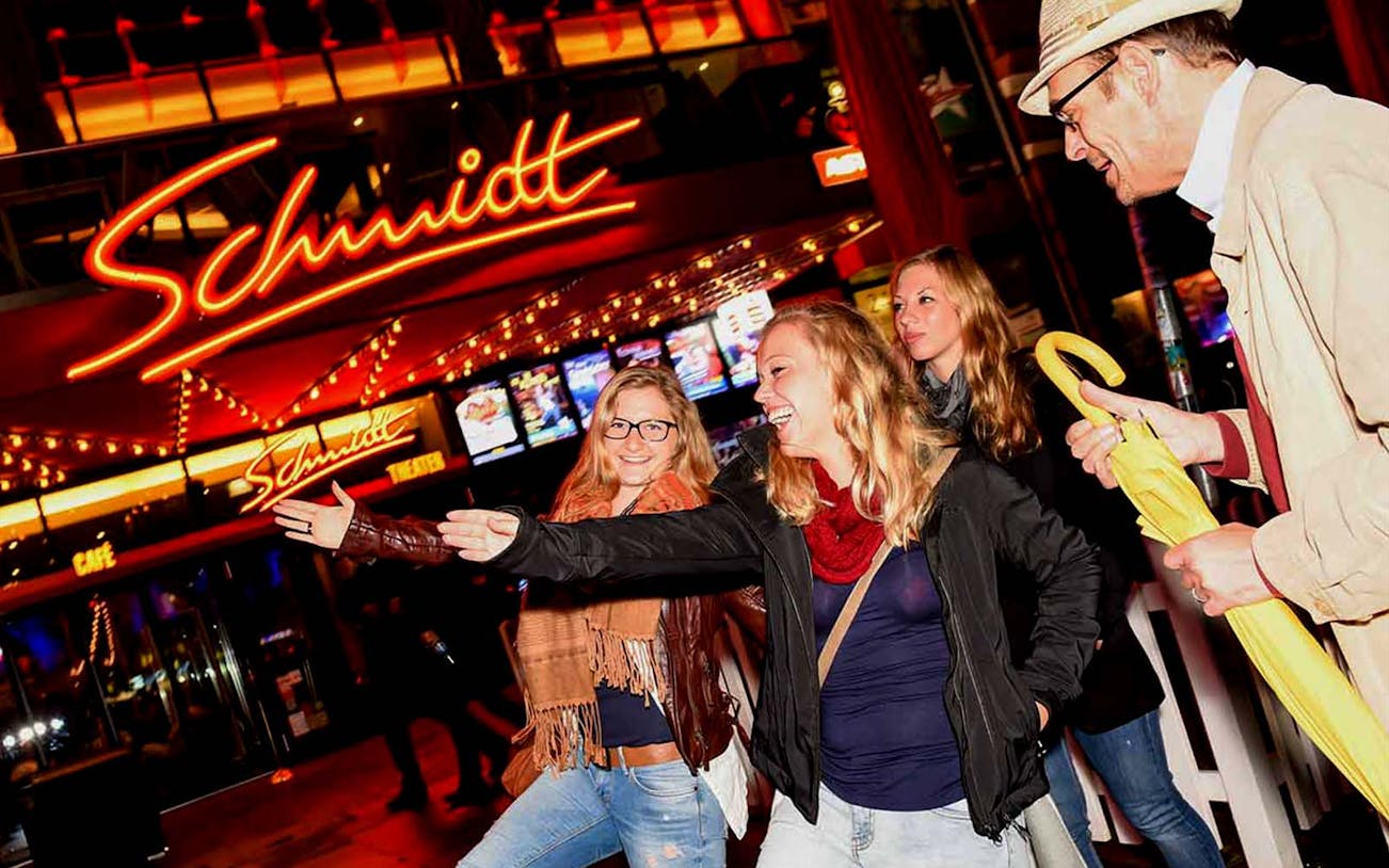 Group enjoying Reeperbahn tour outside Schmidt Theater in Hamburg.