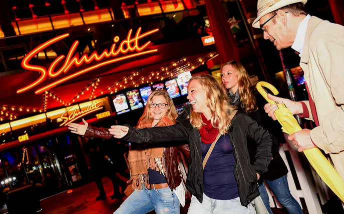 Group enjoying Reeperbahn tour outside Schmidt Theater in Hamburg.