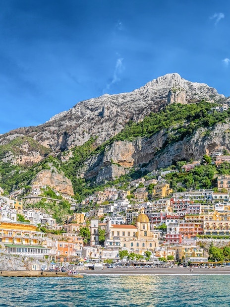 Positano cliffside view with colorful buildings and sea, part of Amalfi Coast tour from Naples.
