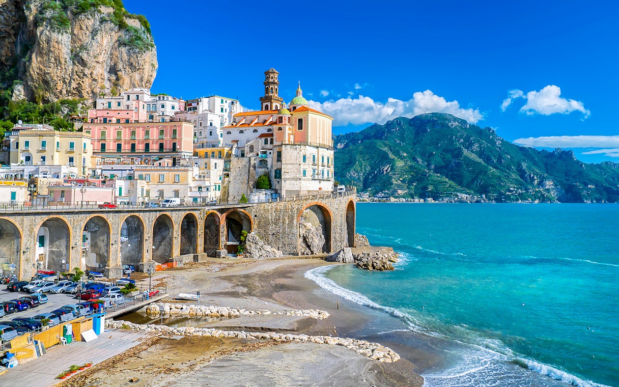 Positano coastal view with colorful buildings and cliffs on Amalfi Coast tour.