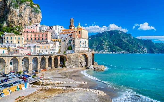 Positano coastal view with colorful buildings and cliffs on Amalfi Coast tour.