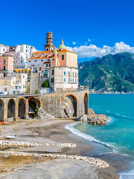 Positano coastal view with colorful buildings and cliffs on Amalfi Coast tour.
