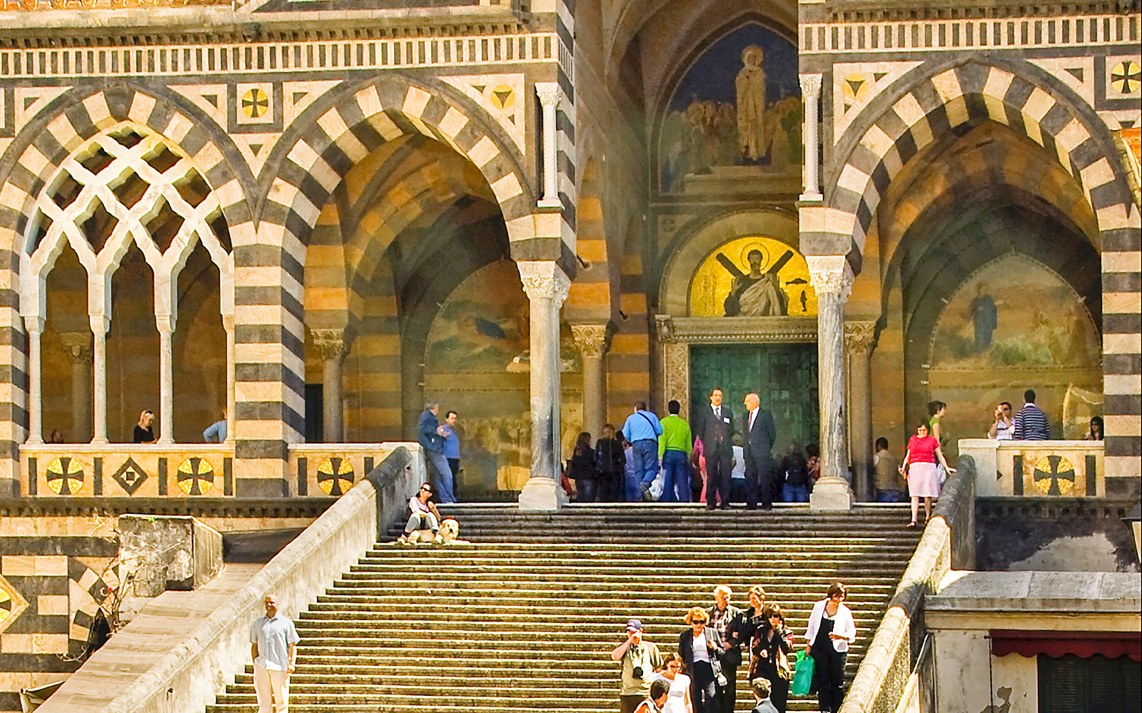 Amalfi Cathedral entrance with tourists on steps during Sorrento, Positano, and Amalfi tour.