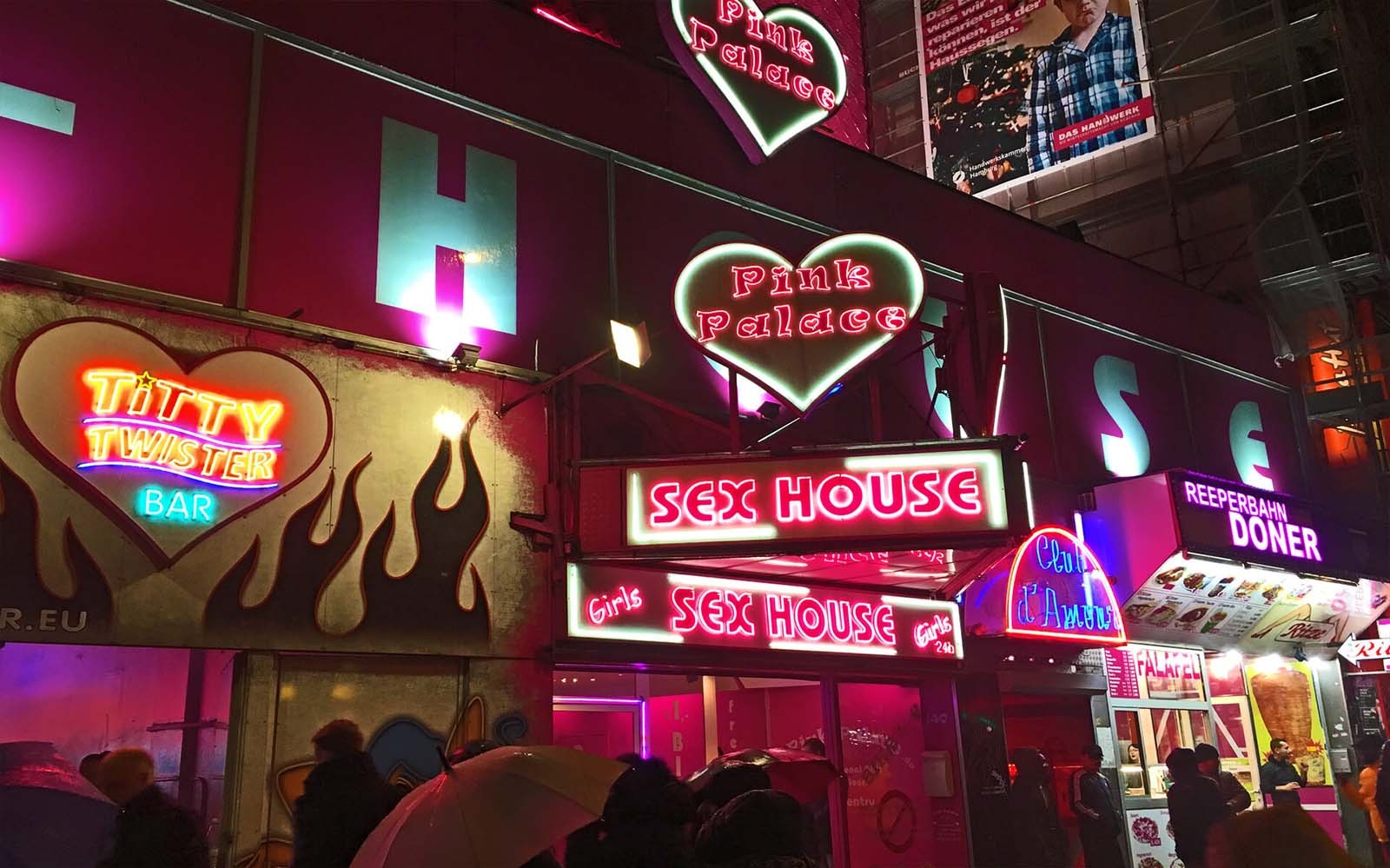 St. Pauli red light district neon signs during guided tour in Hamburg, Germany.