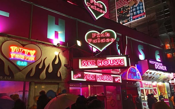 St. Pauli red light district neon signs during guided tour in Hamburg, Germany.