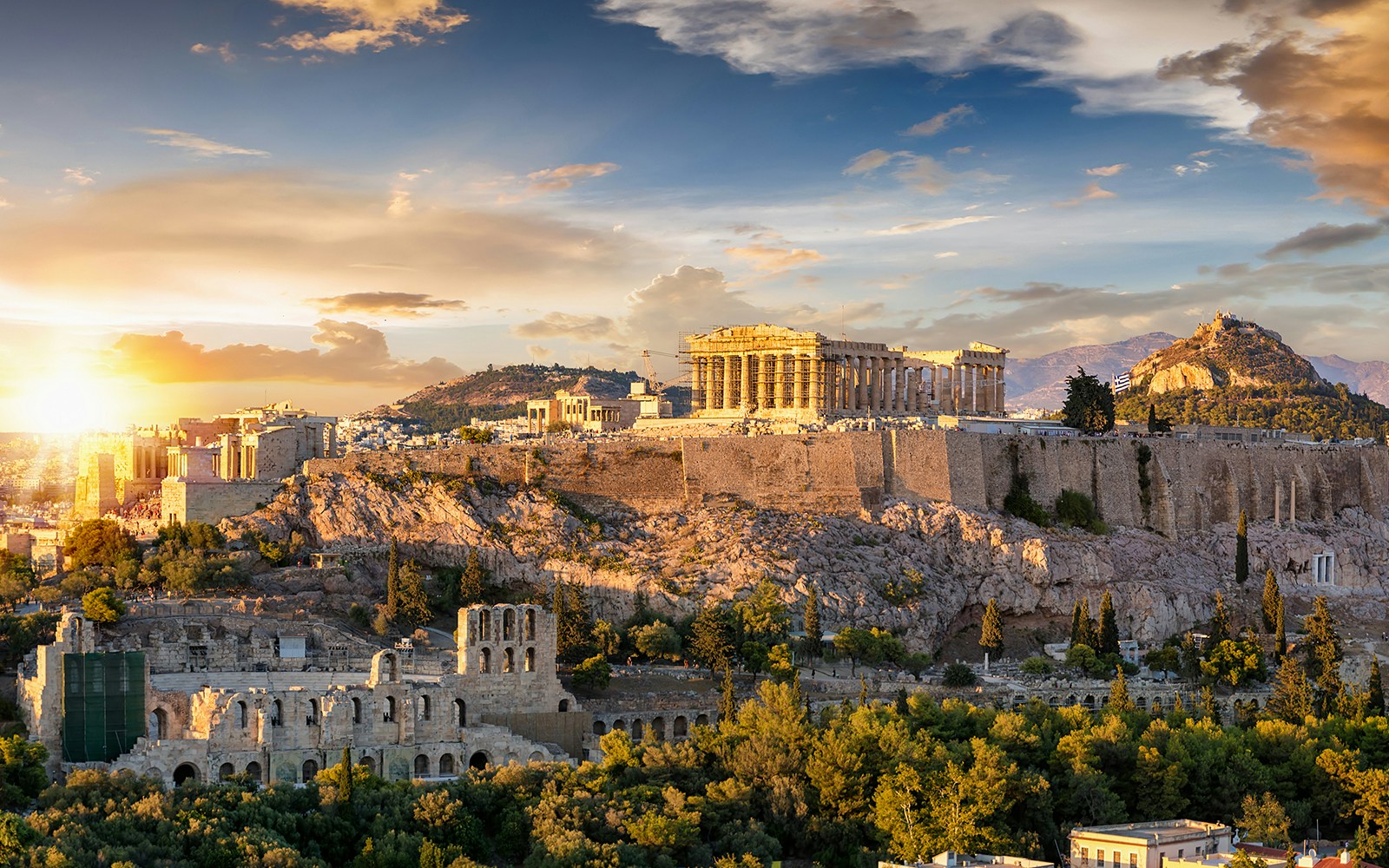 Acropolis of Athens with Parthenon at sunset during afternoon walking tour.