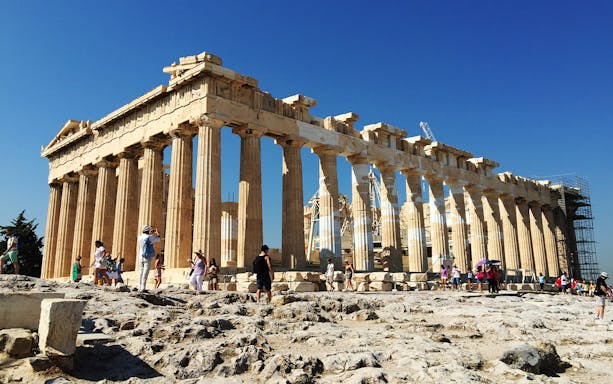 Parthenon temple with tourists at Acropolis, Athens.
