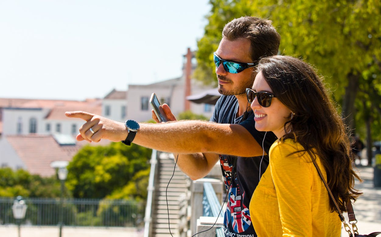 Tourists exploring Lisbon with a 24-hour walking tour pass.