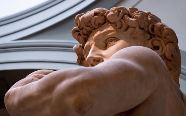 David statue close-up at Accademia Gallery, Florence, on guided tour.