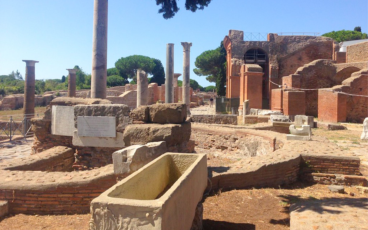 Ancient ruins and columns at Ostia Archaeological Park, Italy.