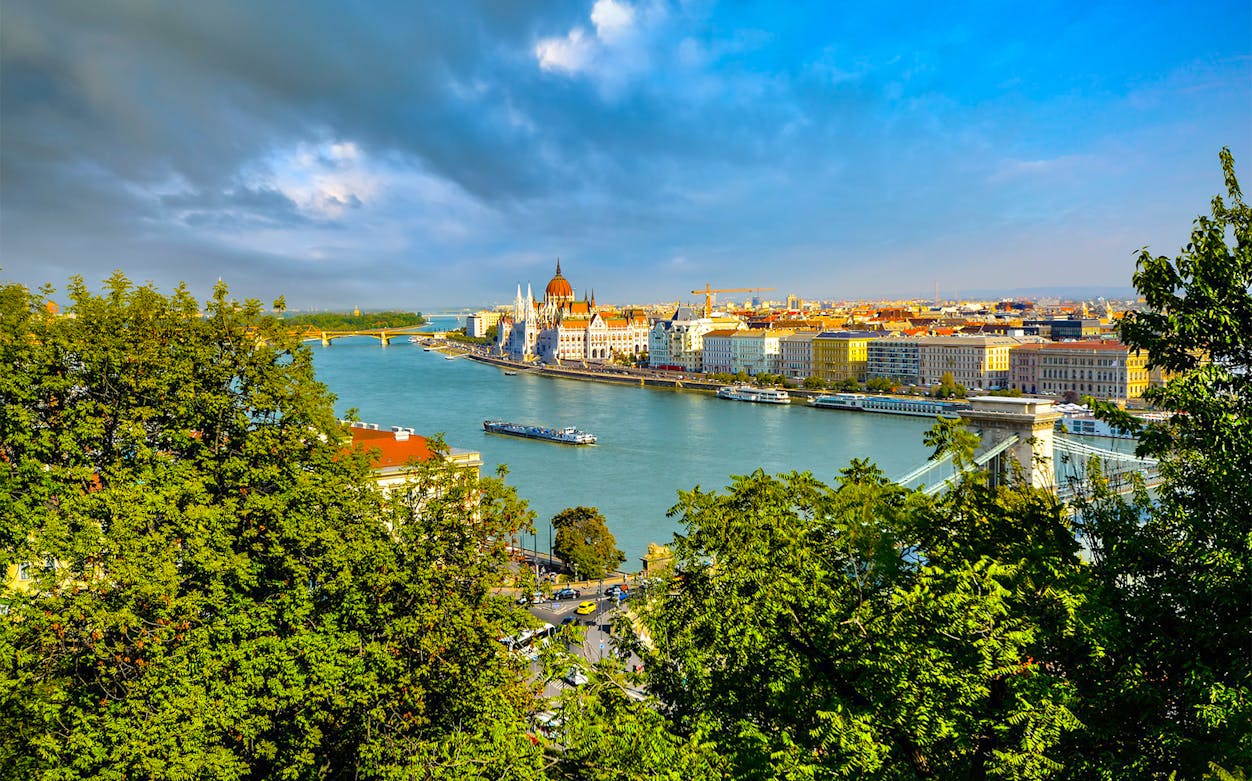 River Danube cruise view with Budapest Parliament and Chain Bridge.