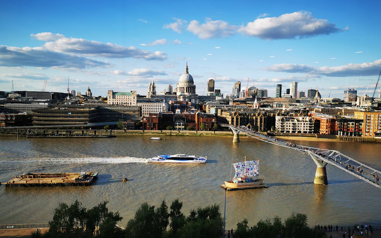 River Thames with Millennium Bridge and St. Paul's Cathedral in London.