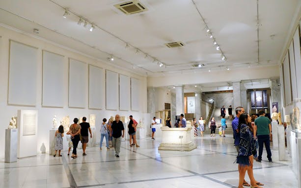 Visitors exploring exhibits at the National Archaeological Museum.