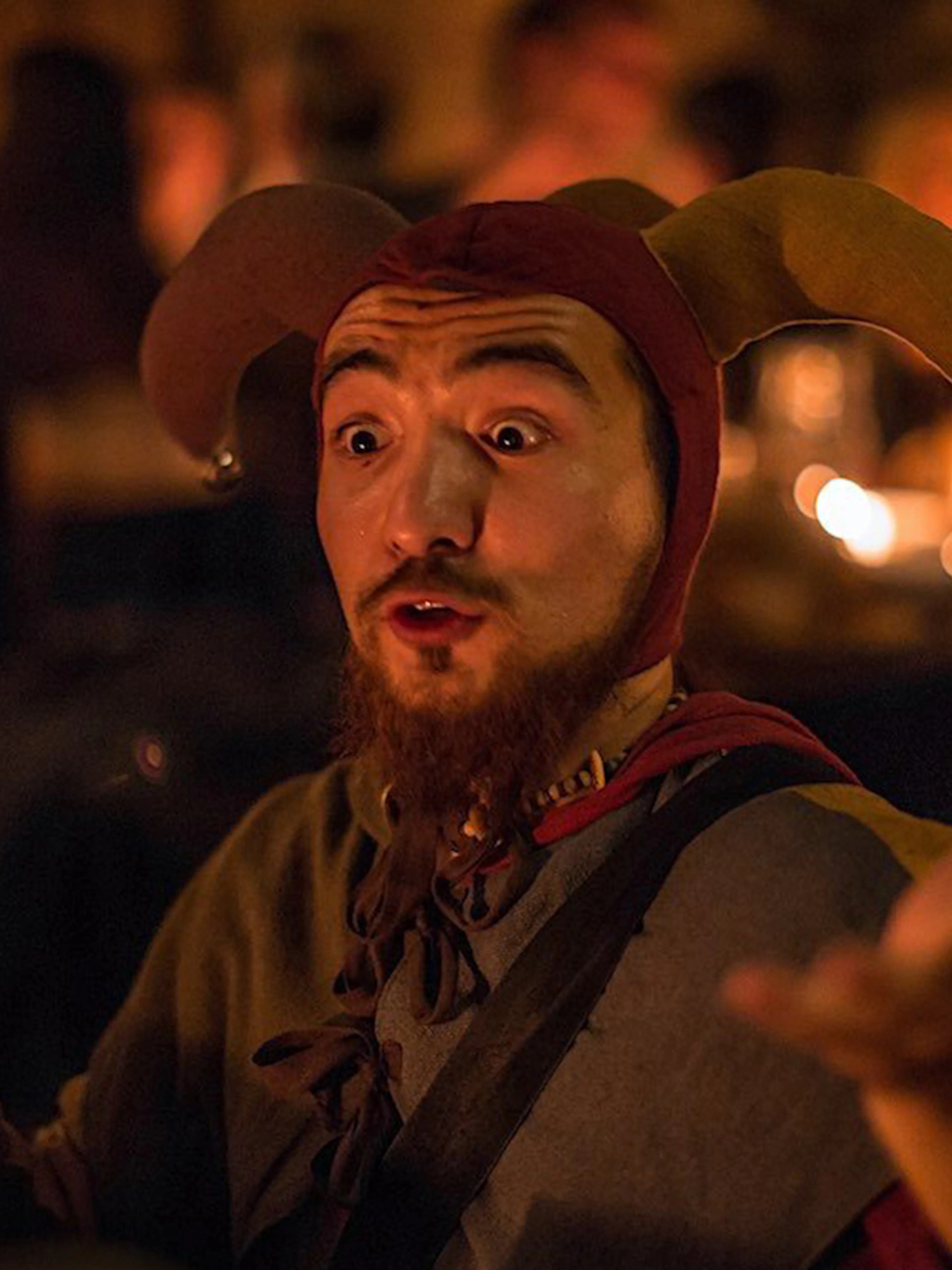Jester performing at a medieval dinner on New Year's Eve.