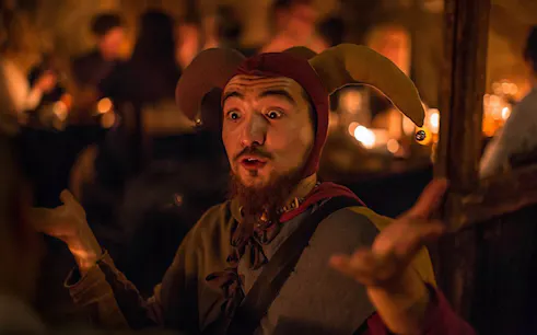 Jester performing at a medieval dinner on New Year's Eve.