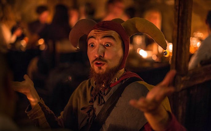 Jester performing at a medieval dinner on New Year's Eve.
