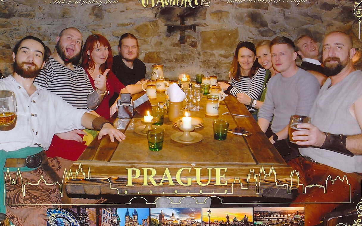 Medieval dinner gathering in Prague for New Year's Eve celebration.