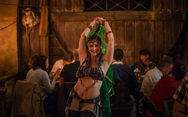 Dancer performing at a medieval-themed New Year's Eve dinner.