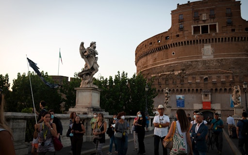 Tour group on a guided walking tour near Castel Sant'Angelo in Rome.