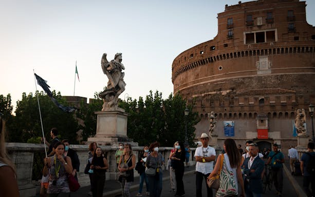 Tour group on a guided walking tour near Castel Sant'Angelo in Rome.
