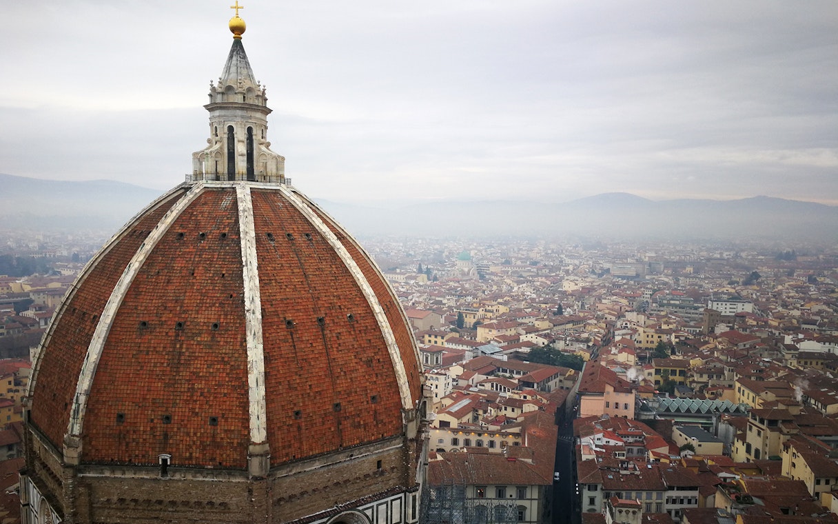 Brunelleschi's Dome overlooking Florence cityscape on a guided tour.