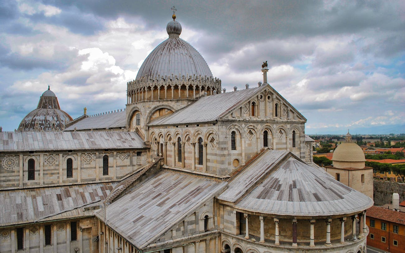 Pisa Cathedral with cloudy sky, part of Pisa: Half-Day Tour from Florence.