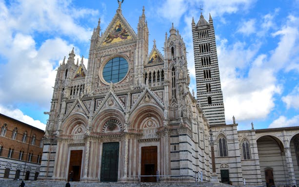 Small group exploring the historic town of San Gimignano and the Chianti region on a tour from Florence, Siena