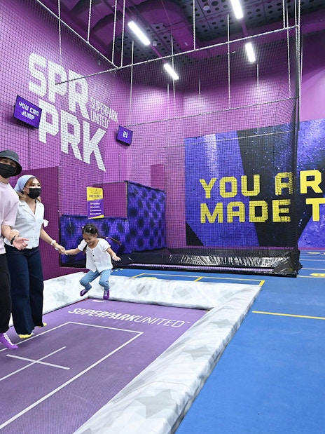 Visitors enjoying trampoline activities at SuperPark Singapore indoor playground.